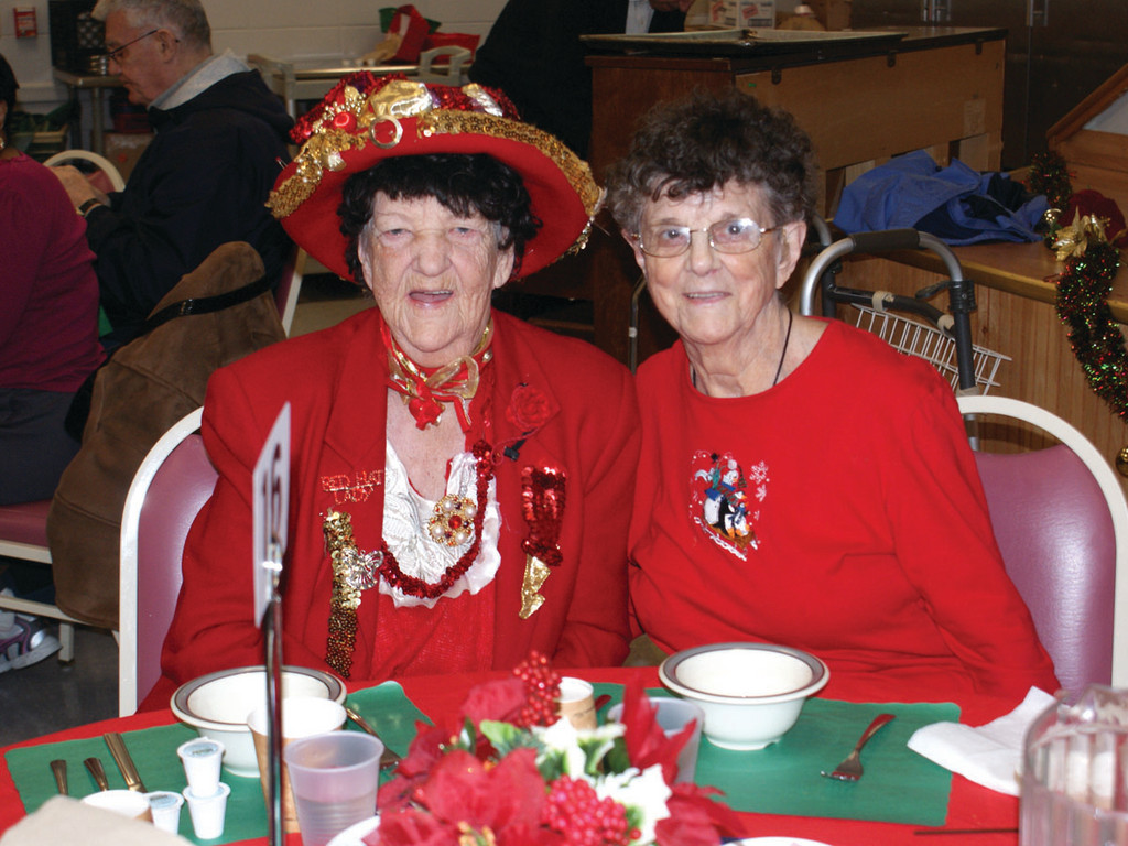 SENIOR CHRISTMAS: Enjoying time together with friends are Elsie O’Reilly and Laretta Barszz during the annual Holiday Luncheon at Cranston Senior Services.
