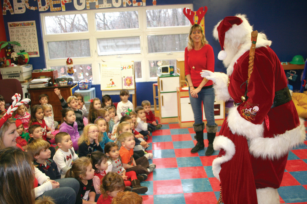 SURPRISE VISITOR: Santa surprises the students at Candy Cane Pre-school.