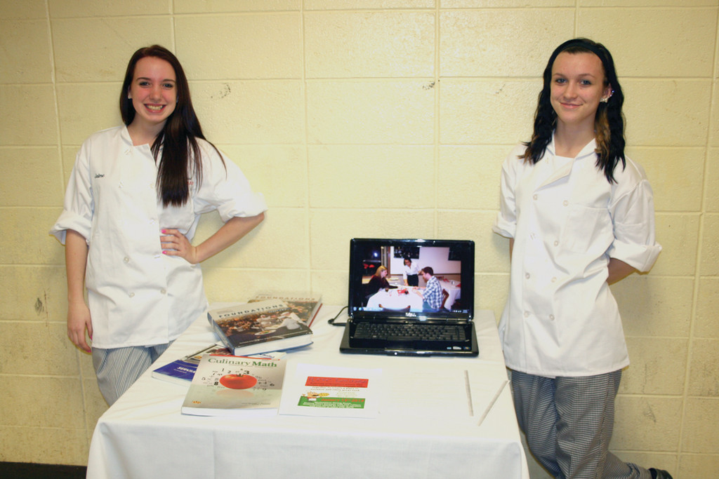 ALL WE HAVE TO OFFER: Jaime Worster and Elizabeth Sousa show a DVD slideshow prepared by the culinary program at CACTC.