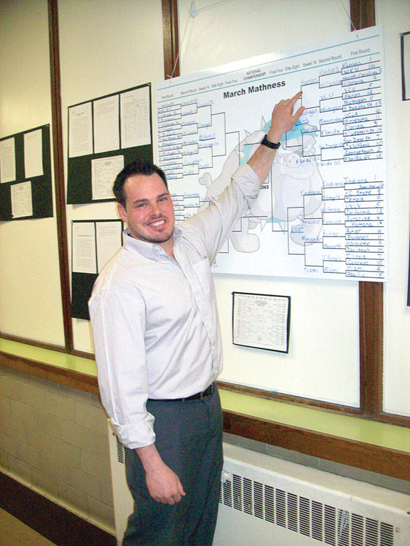 CHECKING THE STATS: Paul Nadeau, a sixth grade teacher at Garden City Elementary School, came up with an innovative way to connect probability, persuasive writing and basketball during last month’s NCAA basketball tournaments. He credits Johnny’s Signs for helping him to create an affordable, reusable sign so that he can teach the same unit again next year.