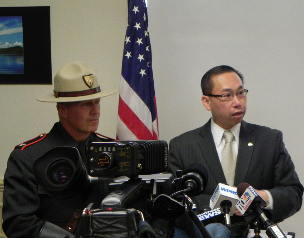 Cranston Mayor Allan Fung addresses members of the media as State Police Col. Steven O'Donnell looks on, Thursday.