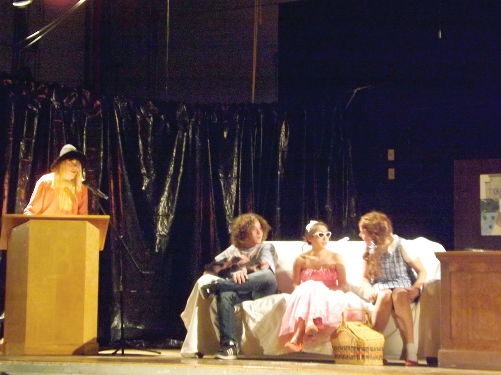 THE GUESTS HOT SPOT: From left, co-host Higgins, a.k.a. Sean Sova, is dressed as the Scarecrow as he talks with special guests Grover Underwood (Joe Scungio), Princess Mia Thermopolis (Maggie Pena) and Dorothy Gale (Baeli Carroll) at Bain’s “Lit Night.”