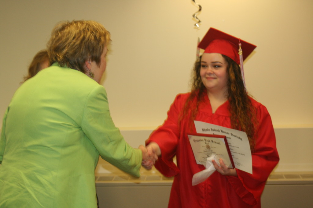 ON BEHALF OF CRANSTON PUBLIC SCHOOLS: Superintendent Dr. Judith Lundsten offers her warm congratulations to Tiffany after she was honored last week at a private graduation ceremony.