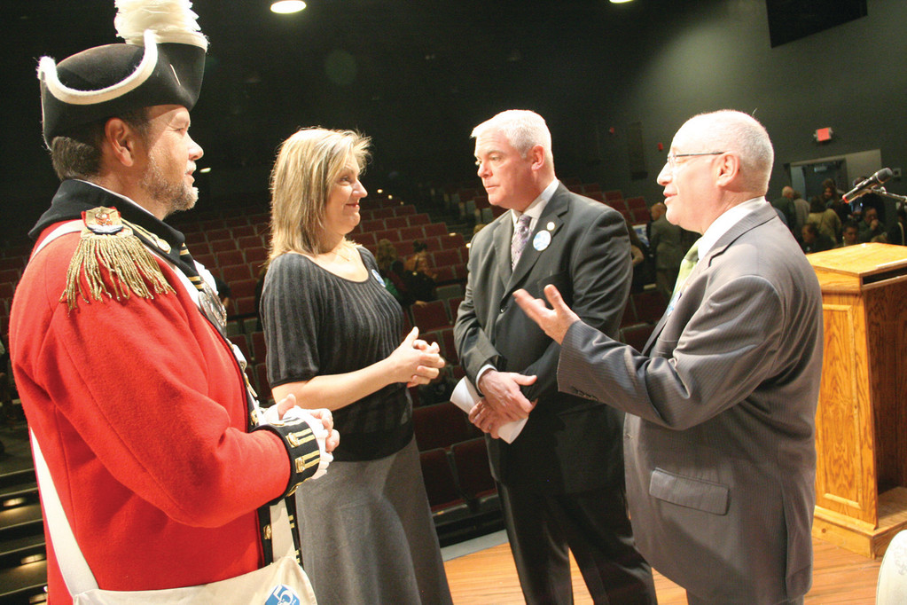 ON STAGE: Col. Ron Barnes of the Pawtuxet Rangers, Amiee Turner of the Ocean State Theatre Company, Mayor Scott Avedisian  and Randall Rosenbaum, director of the Rhode Island Council on the Arts, converse on stage following Monday’s pep rally for Question #5.