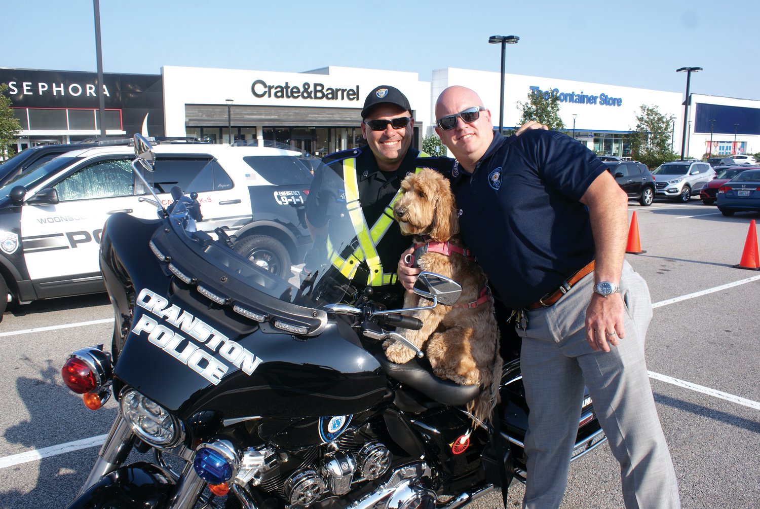 CALI AND CREW: Cali, the therapy K-9 with the Cranston Police Department attempted to take a spin on Inspector Pete Leclerc’s brand new 2021 Harley Electroglide with Cali’s handler, Officer Mike Iacone.