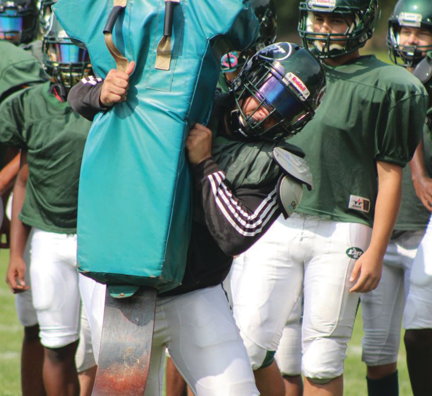 DRIVE THROUGH: East’s Christian Mot delivers a hit on the sled at practice last week.