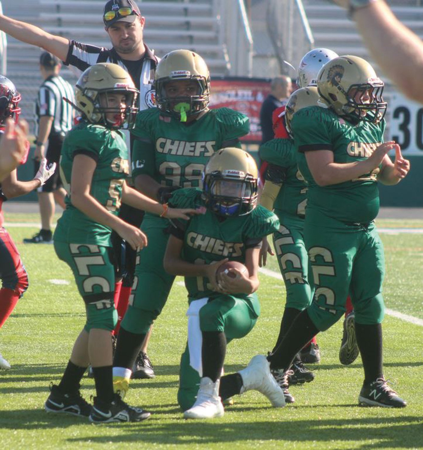 RECOVERY:  The CLCF 10-U team celebrates after recovering a fumble.