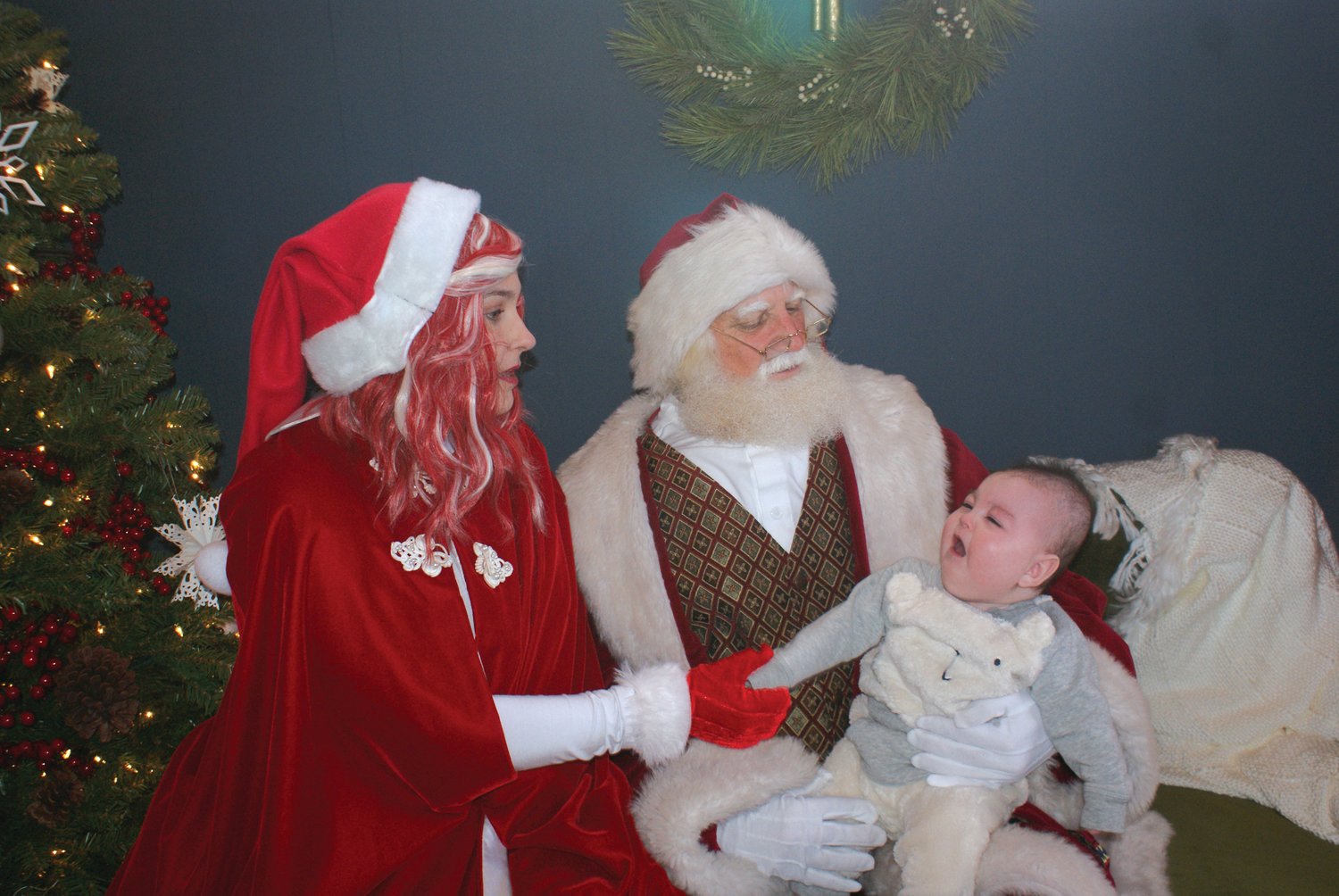 FIRST VISIT WITH SANTA: 6-month-old Rocco Hanley visited Santa in the Garden City Center this past Saturday. Assisting Santa this year was Cringle the Elf.