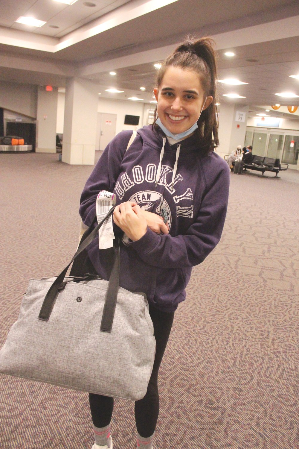 FAR LESS STRESSFUL: Grace Murphy, a Salve Regina student, returning from Oklahoma Sunday found the experience easy going compared to the anxiety she encountered when she made the trip last year.