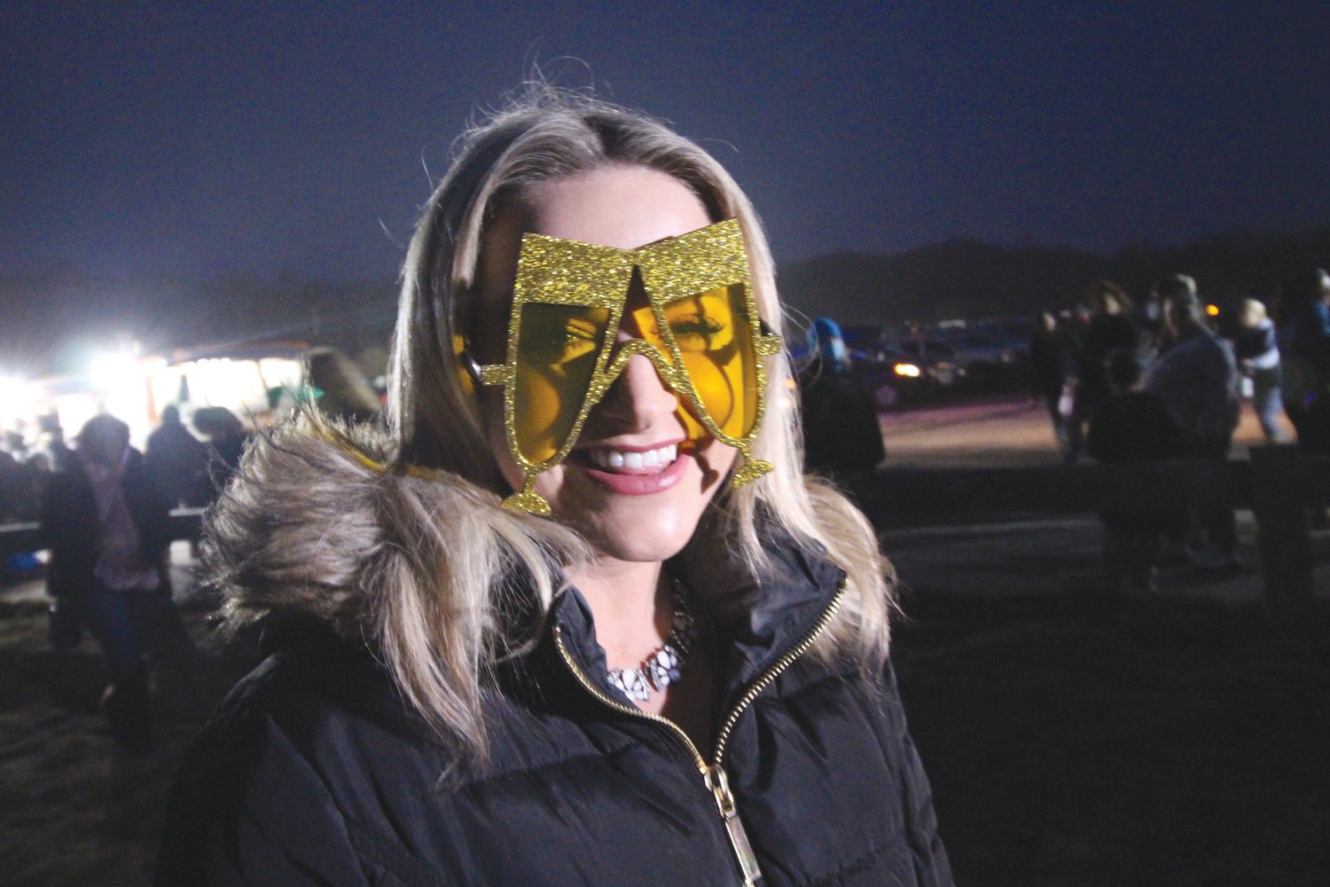 SHE GOT APPROVAL: Before slipping on her champagne “glasses” for a live broadcast from Rocky Point, Channel 10 reporter Sam Reed said she got the director’s approval.