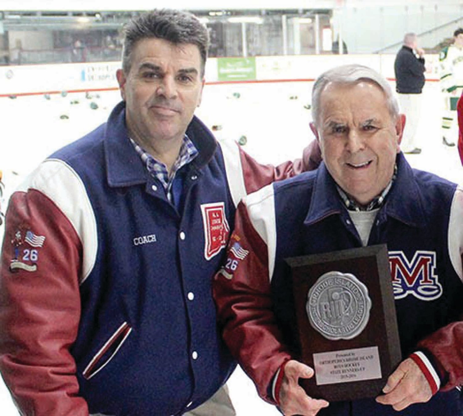 DYNAMIC DUO: Coaches Dave (left) and Bill Belisle receiving a plaque from the RIIL.