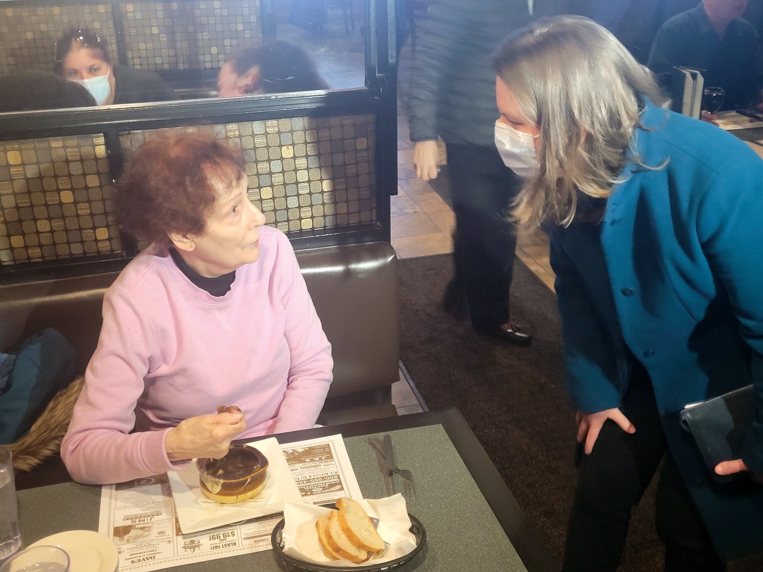 WE MEET AGAIN: Candidate Joy Fox and Atwood Grill patron Theresa Gambardelli remembered each other from long ago. Fox worked for Beacon Communications newspaper the Cranston Herald and Gambardelli worked for the Craston school department. (Sun Rise photo by Rory Schuler)