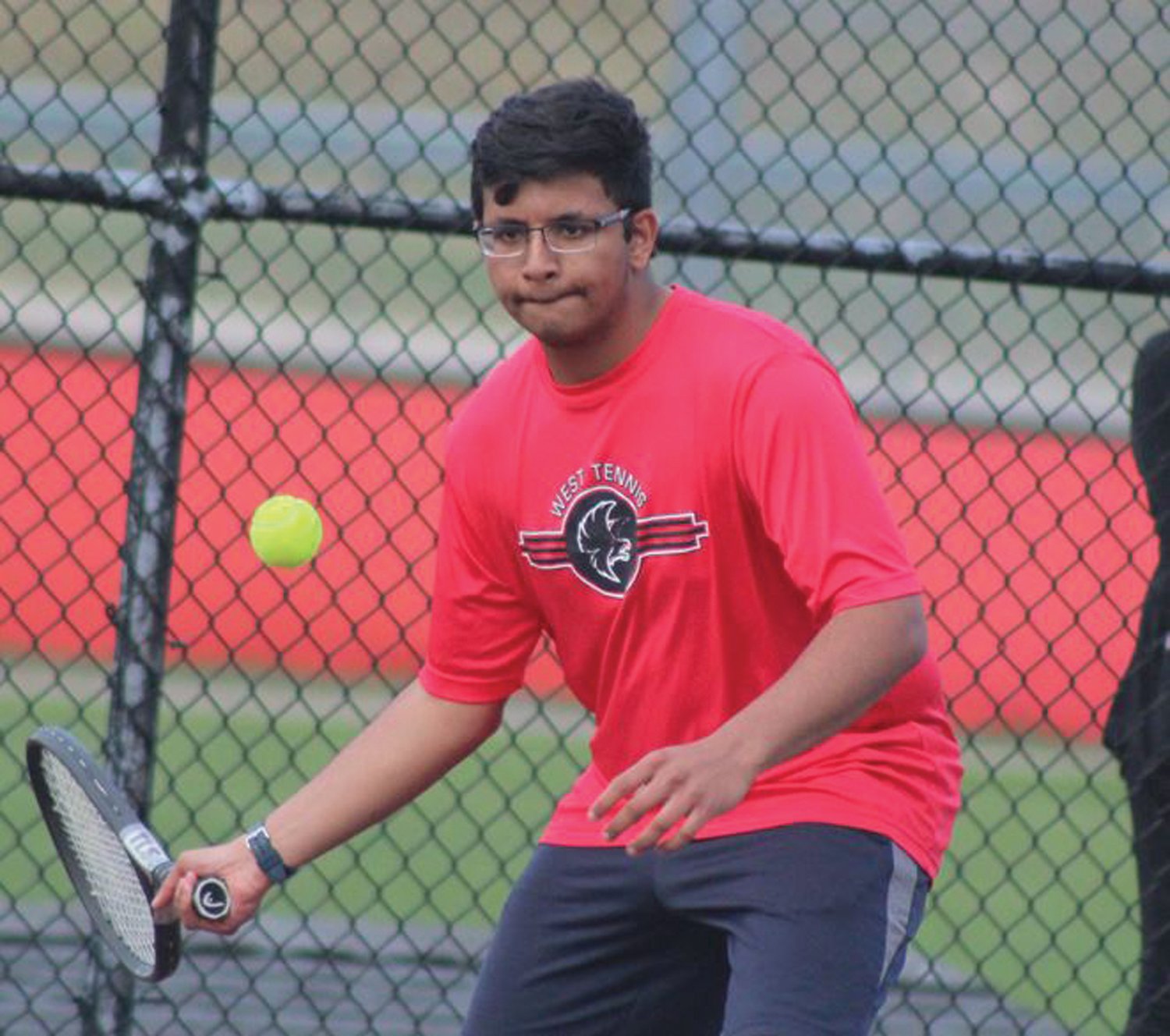 EYE ON THE PRIZE: Cranston West’s Aditya Godbole returns a shot against Cumberland last week in a match at home. The visiting Clippers took home a 5-2 win to hand the Falcons their first loss of the season. The 3-1 Falcons are off to a solid start and are looking to make some noise in Division II this spring. (Photos by Alex Sponseller)