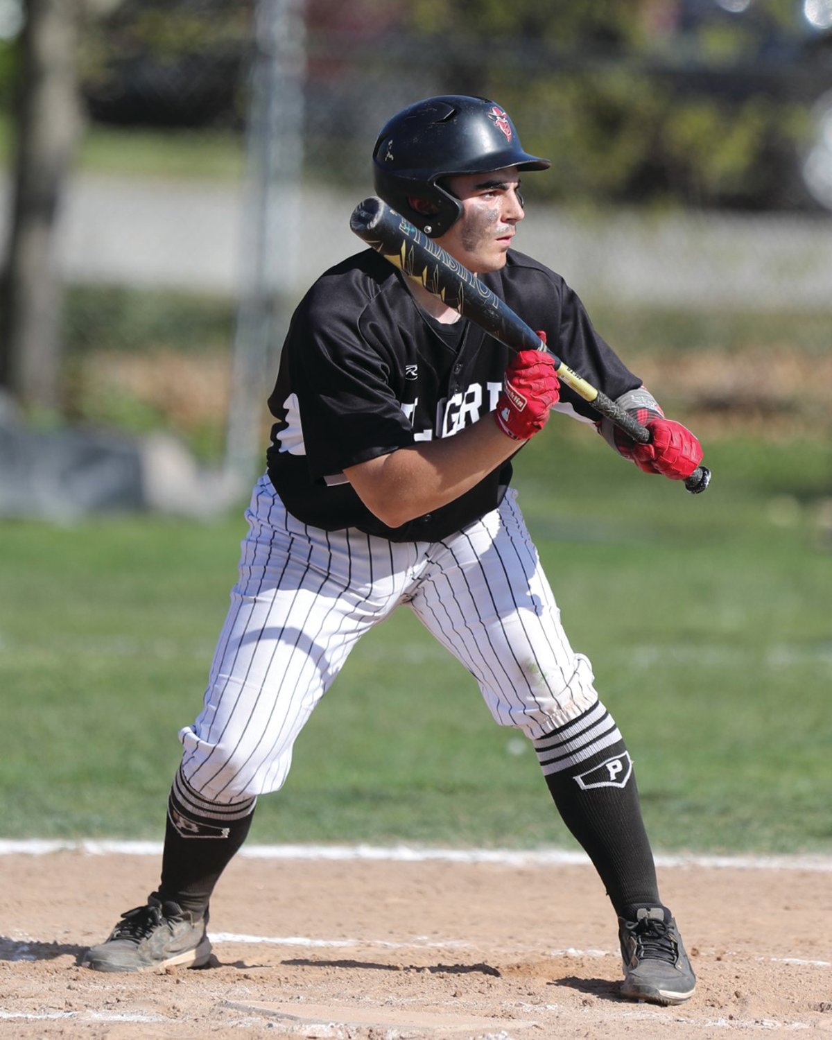LAYING A BUNT: Pilgrim’s Dylan Roberts looks to bunt last week.