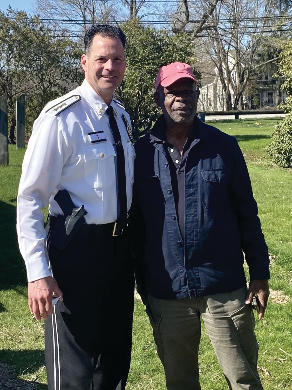 EARTH DAY: Johnston Police Chief Joseph Razza, right, visited the clean up efforts. He posed for a photo with Julius Kolawole, Executive Director of The African Alliance.