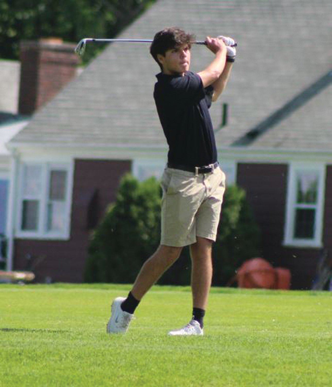 DOWN THE FAIRWAY: Cranston West’s Peter Vachon takes a swing on Monday.