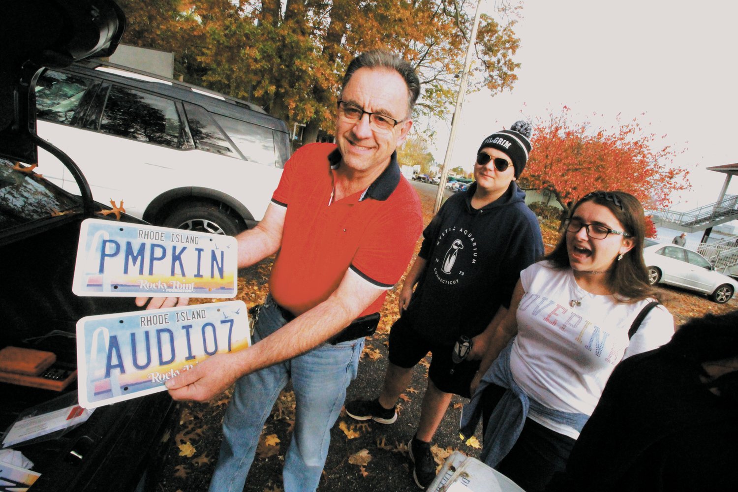 VANITY PLATES: Joe Rodrigues, who was among the first to order the plates when the Rocky Point Foundation started taking orders, joyfully shows off his plates Saturday.  He said it was worth the wait.