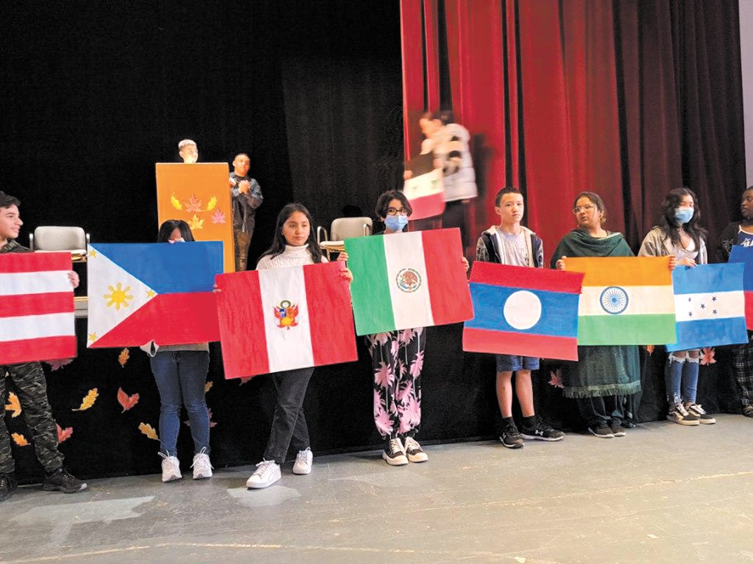 REPRESENTING OUR COUNTRIES: Twenty-three students in the MLL program participated in a parade of flags representing 23 countries that the program’s students have come from. The parade was part of the MLL program’s annual Thanksgivign celebration. (Photos courtesy of Cranston Public Schools)