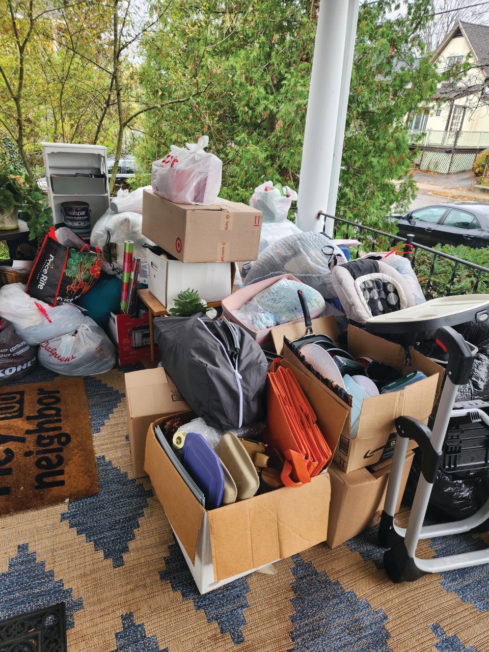 PILES OF DONTATIONS: Edgewood resident Shawn O’Rourke’s porch is loaded with bags of groceries, clothing, toys, furniture and anything that is of need to help people get by.