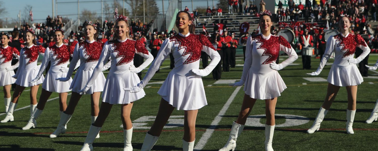 PUTTING ON A SHOW: Members of the West marching squad dance for the crowd on Thanksgiving. (Photo by Mike Zawistoski)