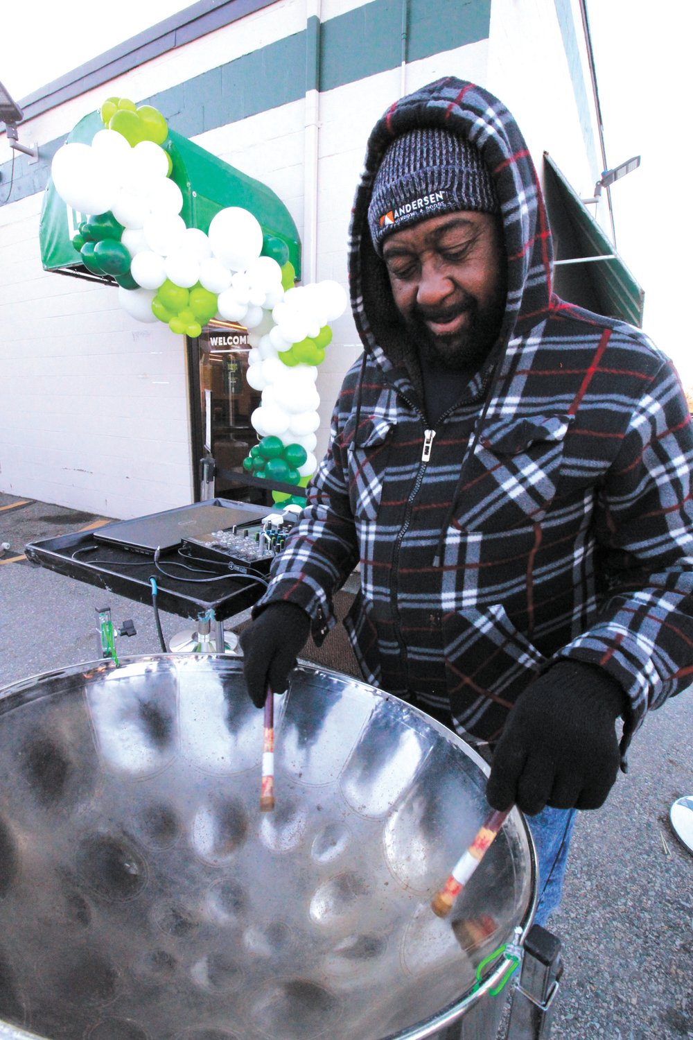 DRUMMING UP BUSINESS: Bernell Henry entertained customers on the opening day of recreational marijuana sales at the RISE shop, formerly the Summit Compassion Center, on Jefferson Boulevard in Warwick. (Cranston Herald photos)