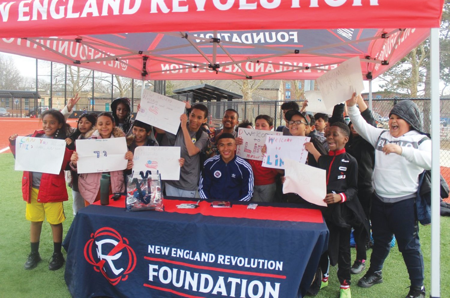 GIVING BACK: New England Revolution player and Cranston native Damian Rivera (sitting) joins a group of local soccer players at his youth clinic last week in Providence. (Photos by Alex Sponseller)