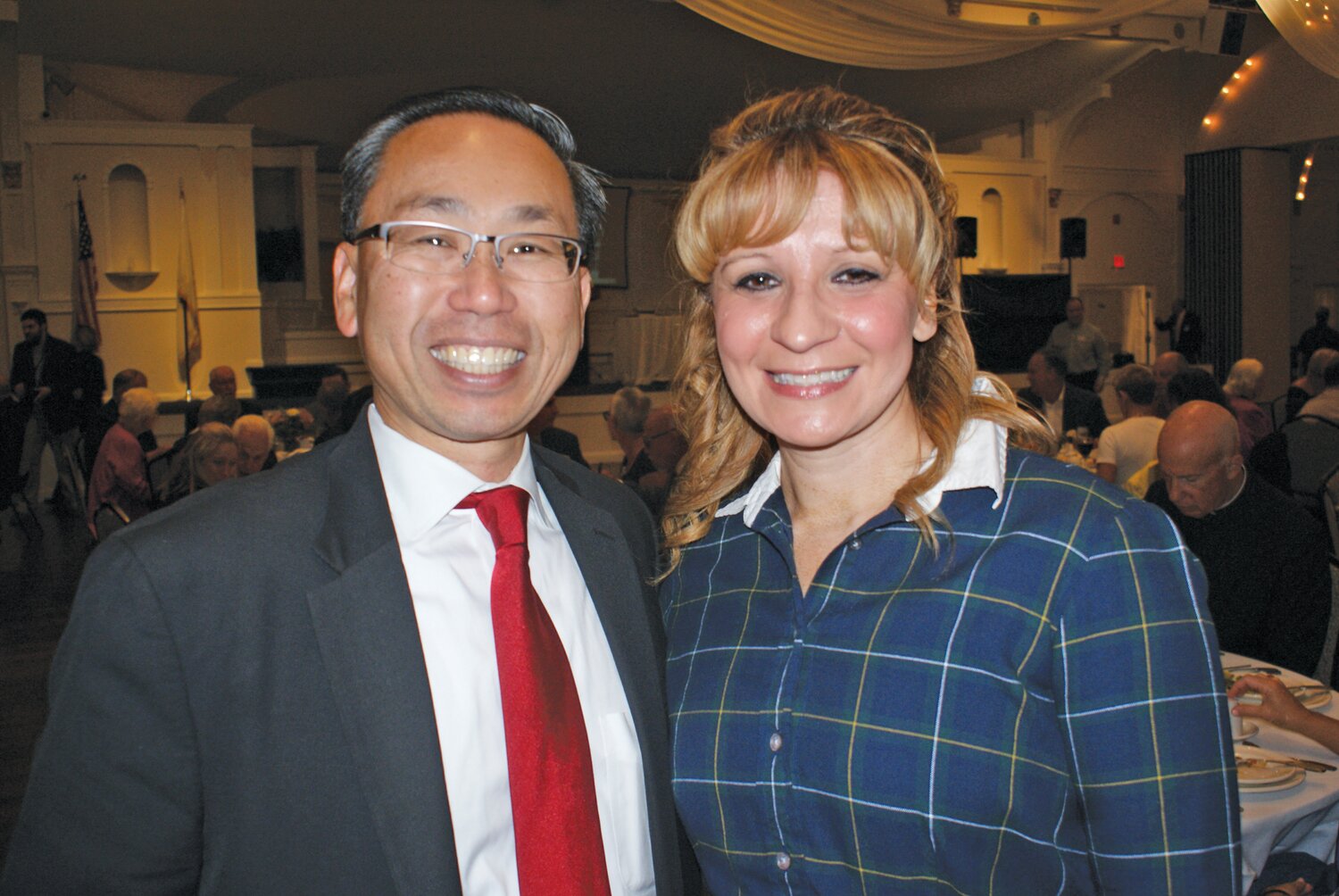 STOPPING BY: Former Cranston Mayor Allan Fung and his wife, 15th District House Representative Barbara Ann Fenton-Fung, enjoy the centennial. (Photo by Steve Popiel)