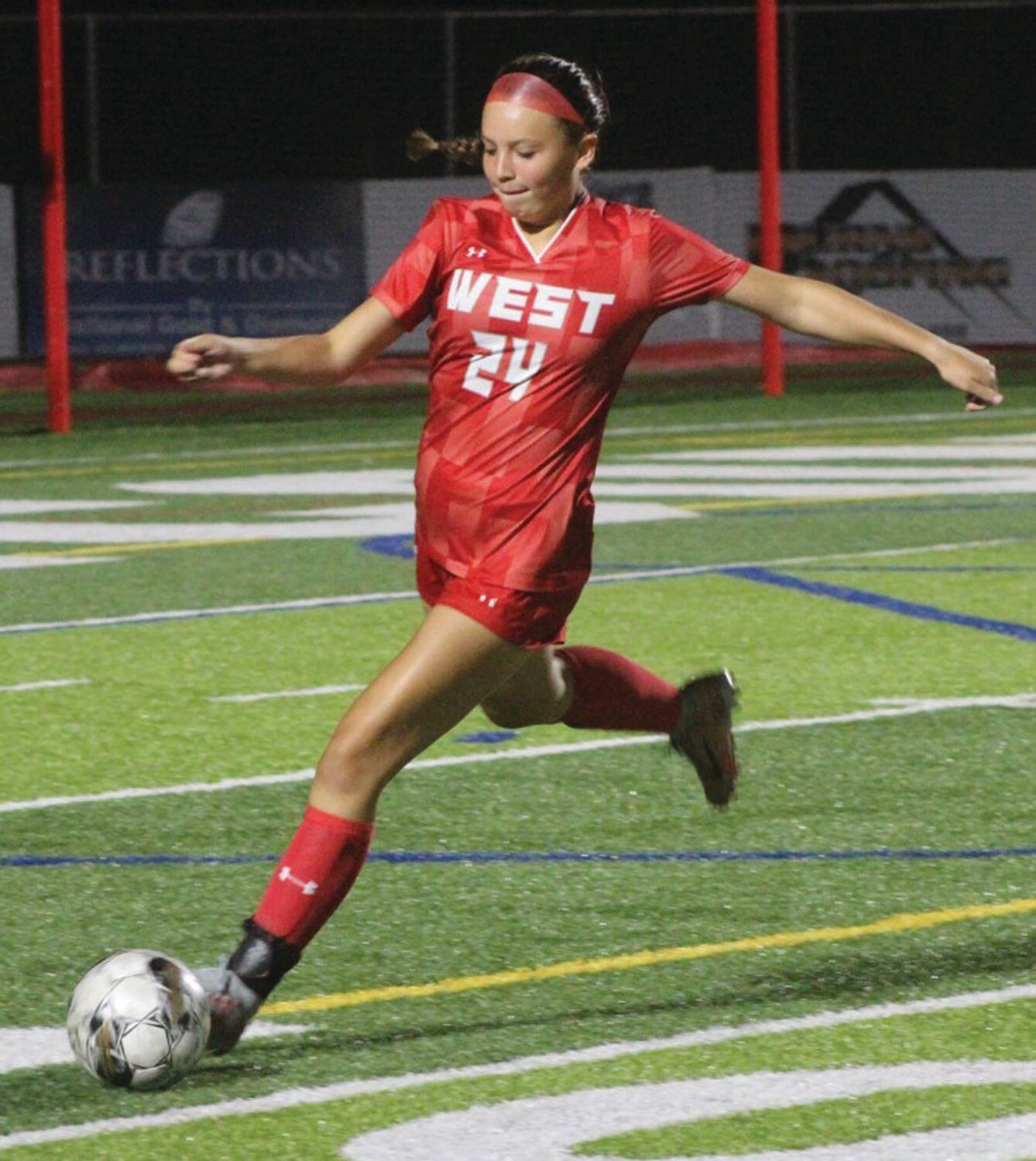 BEST FOOT FORWARD: Caitlyn Blanchette looks to clear the zone.